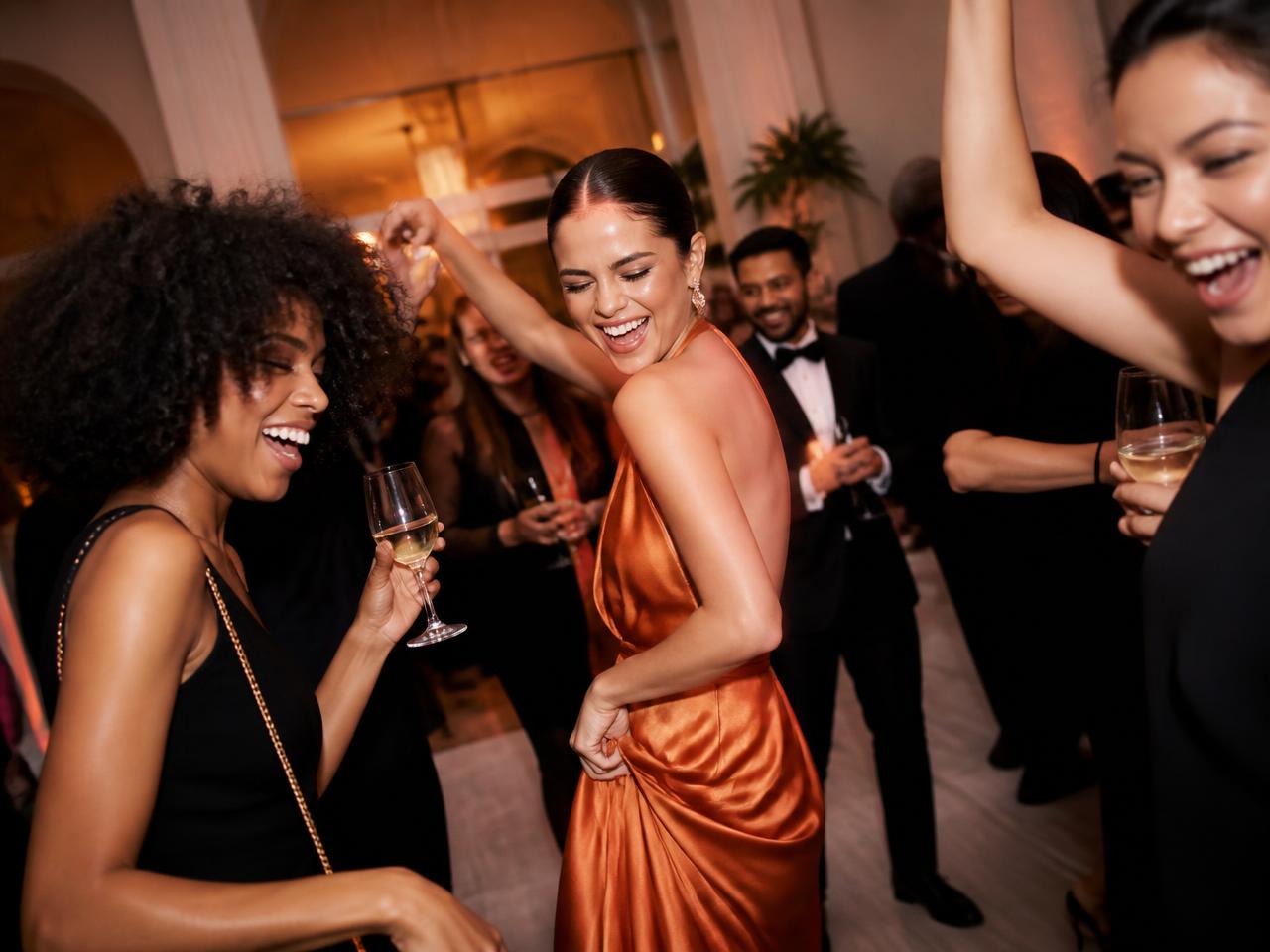 Guests celebrating on the dance floor at an evening reception in Houston